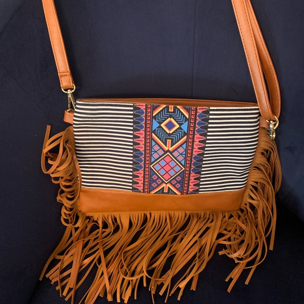 Navy and white crossbody purse. Fringe detail